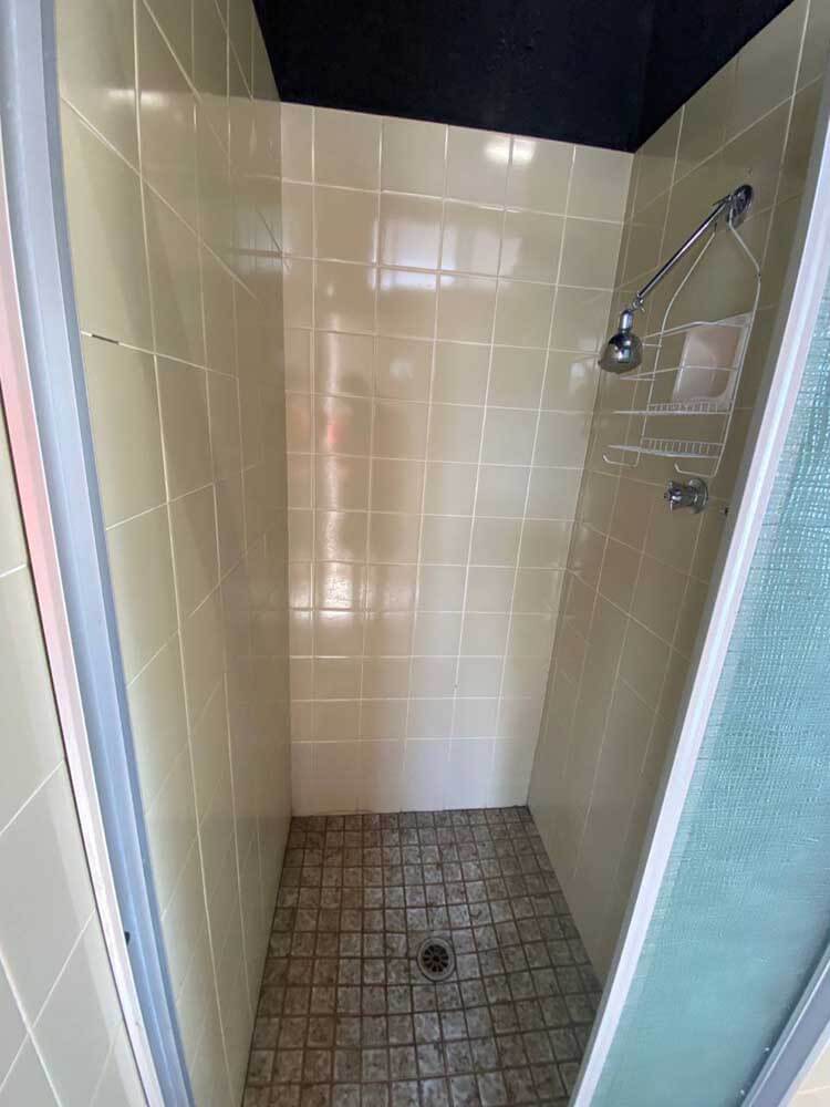 Tiled ensuite shower with chrome showerhead and wire rack. One of the guest facilities at Stawell Grampians Gate C&C Park.