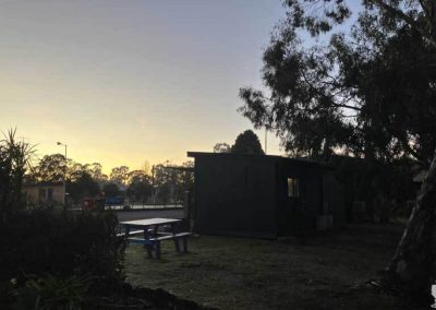 Early morning tranquility settles over Stawell Grampians Gate C&C Park as the sky begins to glow with the first light of day.