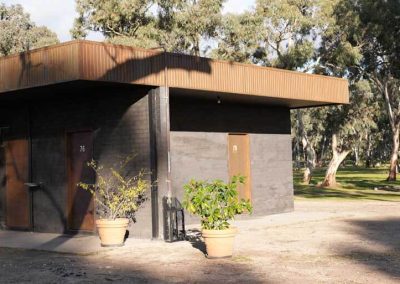 Ensuite sites 76 and 79 at Stawell Grampians Gate C&C Park, surrounded by trees.
