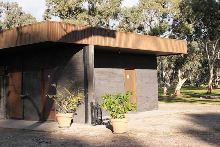 Ensuite sites 76 and 79 at Stawell Grampians Gate C&C Park, surrounded by trees.