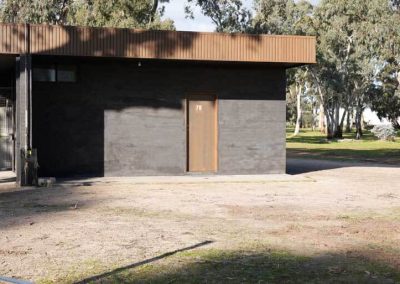 A compact ensuite unit set among the trees. One of the Cabins, Dwellings, Caravans, & Glamping Tents available at the park.