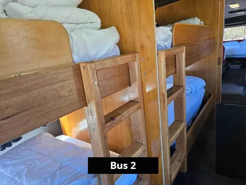 Timber bunk beds in a renovated bus accommodation, ideal for family or group stays near the Grampians.